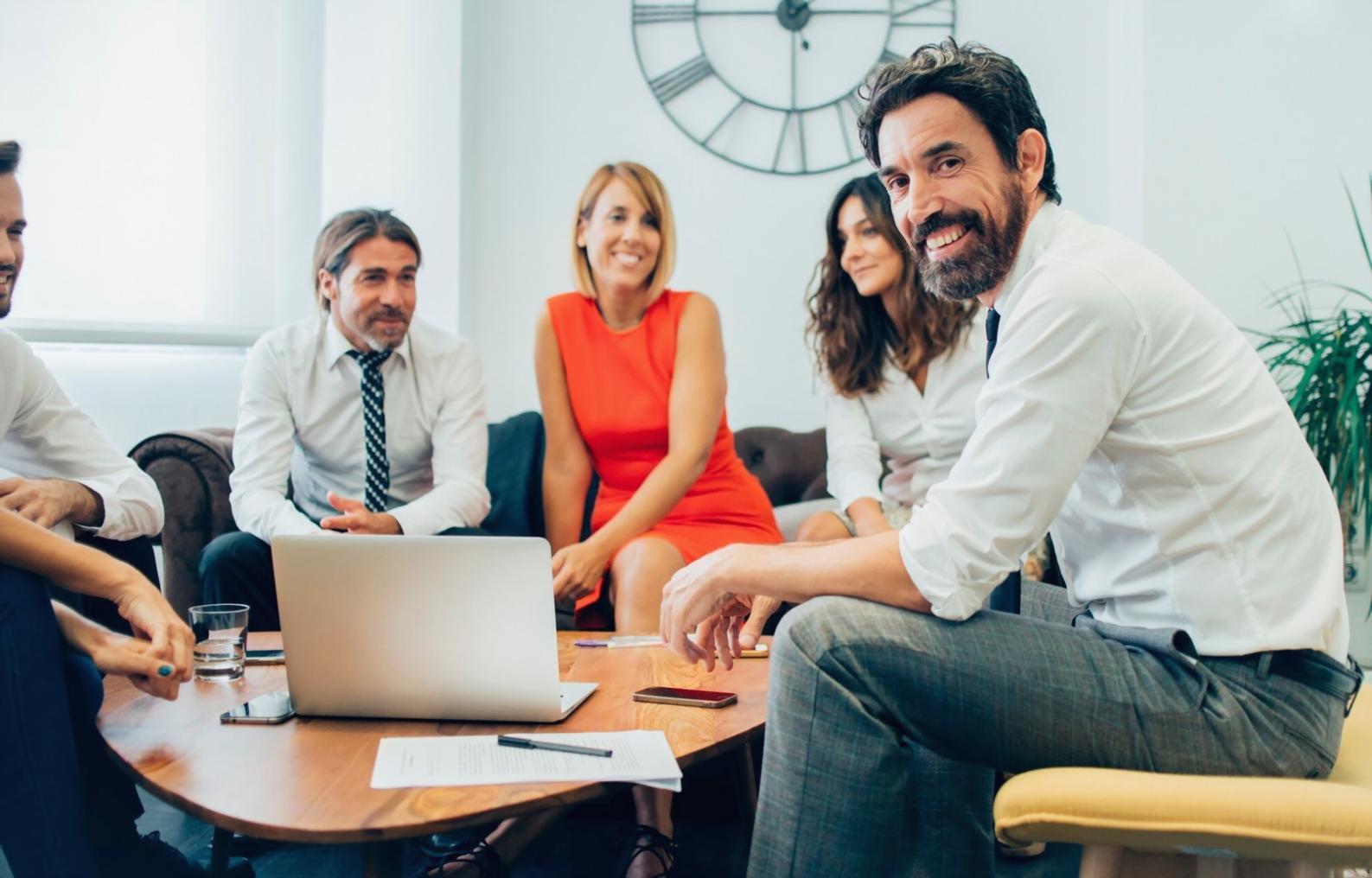Business meeting with financial charts and collaborative analysis